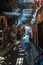 Locals and tourist walking in narrow street in Marrakesh