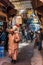 Locals and tourist walking in narrow street in Marrakesh