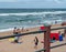 Locals and tourists on the beach near the Millennium Pier and lighthouse in Umhlanga Rocks