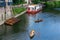 Locals and tourists enjoying the sunshine on the riverside Wear river in Durham