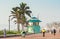 Locals and tourists near the lifesaver\'s station on The Golden Mile promenade