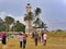 Locals walking by the lighthouse near the beach, Galle, Sri Lanka