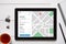 Location tracker concept on tablet screen. GPS map navigation ap