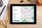 Location tracker concept on tablet screen. GPS map navigation ap