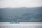 Loch Lomond Scotland, UK, September 19th 2023, Canoe rowing across Loch Lomond during dull wet weather