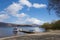 Loch Lomond Scotland UK summer with blue sky boat and jetty popular Scottish tourist destination