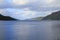 Loch Ness in highlands of Scotland with fort Augustus with mountains