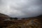 Loch Ossian in Rannoch Moor, Scotland under stormy skies