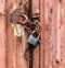 Lock on a chain on a rusty metal container