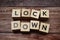 Lock down alphabet letters on wooden background