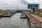 Lock in Dutch canal Gent - Terneuzen with passing cargo ships