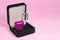 Lock in gift box. Pink padlock with open shackle in jewelry chest. Concept of security safe or protection software or hardware.