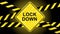 LOCKDOWN lettering on a warning sign with warning tapes striped in black and yellow against a black background