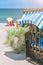 Locked blue colored roofed chairs on sandy beach in Travemunde, Germany