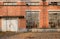 Locked door of deserted 1970s` workshop in boiler factory