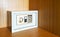 Locked metal security safes inside wooden cupboard