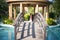 locked shot of arched wooden bridge with swimming pool on both sides with blue water and out of focus people in the