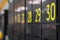 Lockers in a co working space. Gray doors with big yellow numbers