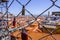 Locks as a proof of love attached to a fence over the rooftops of Lisbon