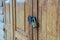 Lockset on wooden door pattern textured background, antique place in Thailand.