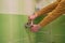 A locksmith with an adjustable wrench installs a faucet,installing a shower faucet in the bathroom