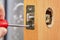 Locksmith installs door knob with lock. An Carpenter pushes standard rectangular faceplate, slide the latch into place with the