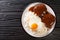 Loco Moco recipe is a delicious Hawaiian dish consists of white rice, a juicy hamburger patty, a fried egg, and brown gravy close-