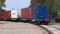 Locomotive with containers. Railway train with containers. Freight train transports containers