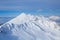 Lodge in mountain covered with snow in mountain ski resort Rosa Khutor Sochi