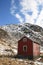 Lofoten house against the blue sky and mountains