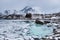 Lofoten islands, Norway. Rocky coast of fjord in winter with snow and ice.