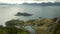 Lofoten Islands shore with little rocky islands and green coast