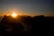 Lofoten midnight sun over sharp mountains of Moskenesoya seen from Munken peak summit, sunset and sunrise combined, Norway