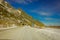 LOFOTEN, NORWAY, APRIL, 10, 2018: View of frozen street with an informative sign at the enter of a tunnel in Skjelfjord