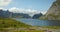 Lofoten, Reine panoramic shot of Nordic Fjords and the blue lake.