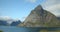 Lofoten, Reine static shot of huge mountain and the blue lake.