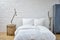 Loft atmosphere bedroom white linen and birch branches