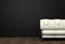 Loft interior mock up photo. Brown leather sofa. Minimalist style. Background photo with copy space for text. Black wall