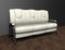 Loft interior mock up photo. White leather sofa. Background photo with copy space for text. Black wall and wooden floor