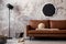 Loft style of modern apartment with mock up poster frame, brown sofa modern black lamp, round pillow, books, basket and personal