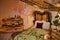 A loft style and rustic bedroom with Christmas or New Year decorations. Poor room in the attic. A cozy place with a