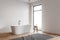 Loft white tile bathroom corner with tub