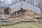 Log cabin being demolished