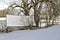 Log cabin covered with snow