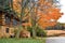 Log Cabin in Fall with Stone Foundation