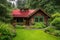 log cabin house with red roof and green shutters, surrounded by lush greenery