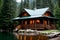 A log cabin on a lake in the woods.