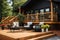 a log cabin with a large front deck, outdoor furniture in view