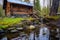 log cabin near a bubbling brook, fishing hat on staircase