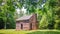 Log Cabin with Stone Chimney